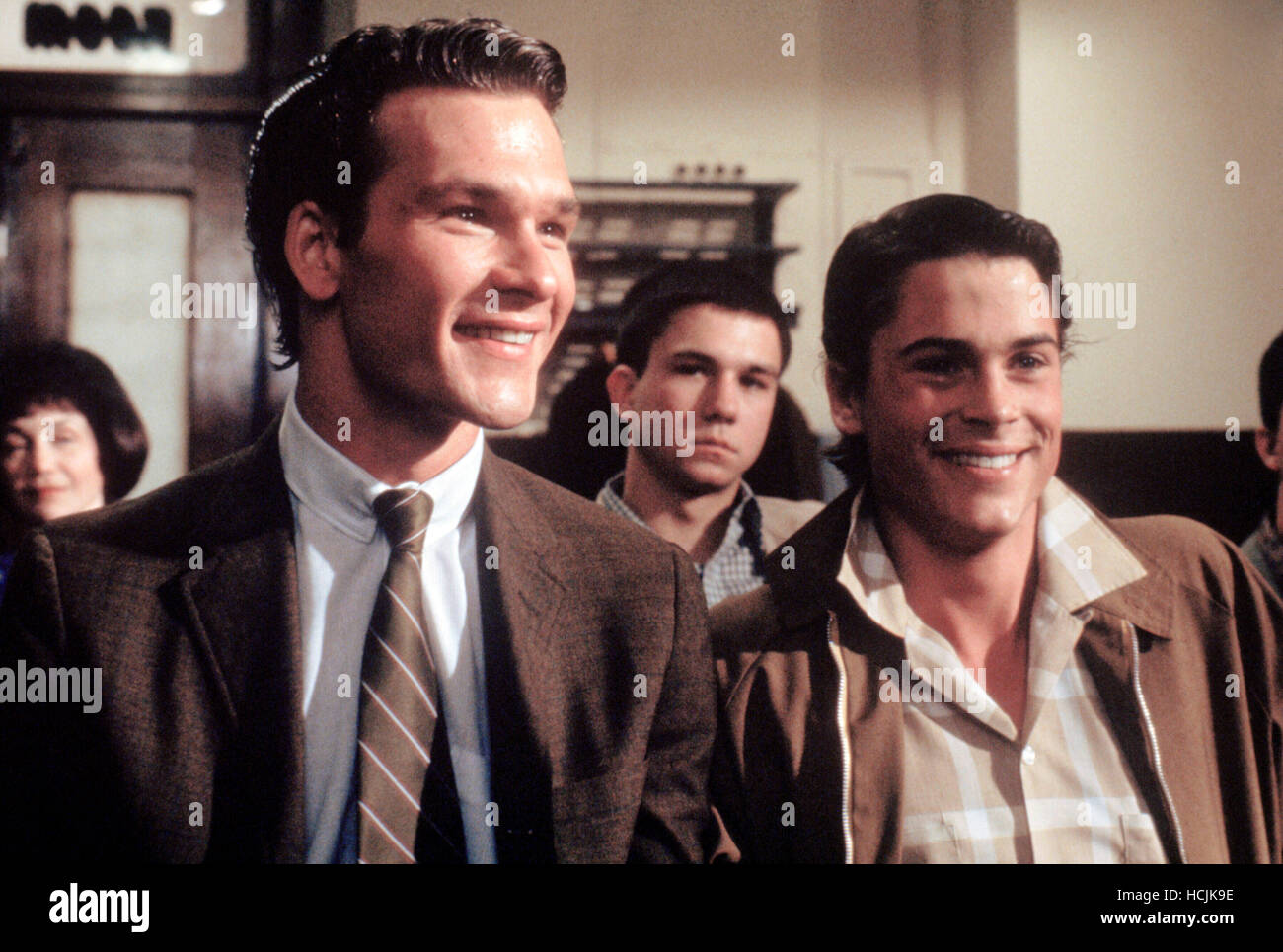 THE OUTSIDERS, front from left Patrick Swayze, Rob Lowe, 1983