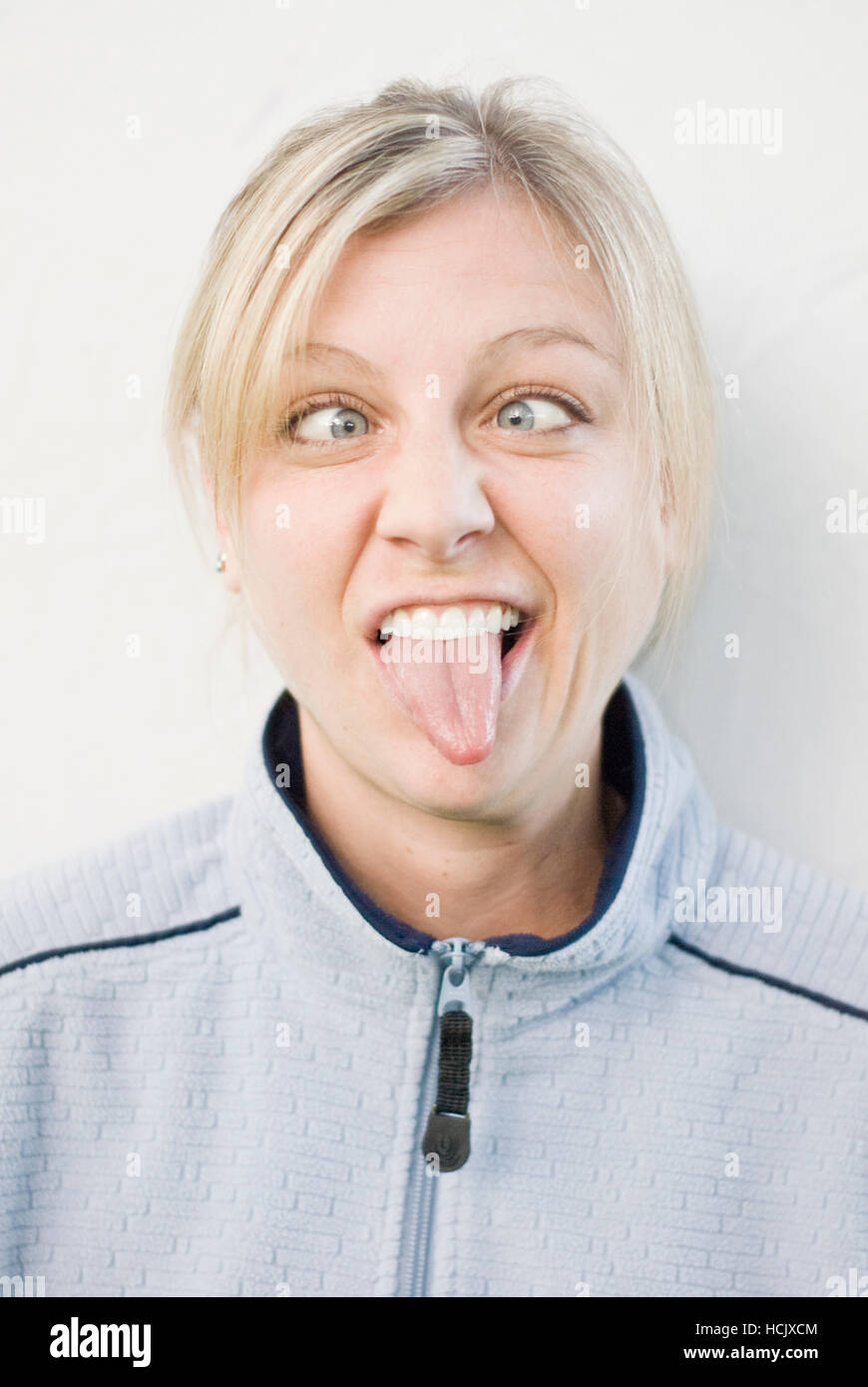 Portrait woman eyes crossed tongue hires stock photography and images