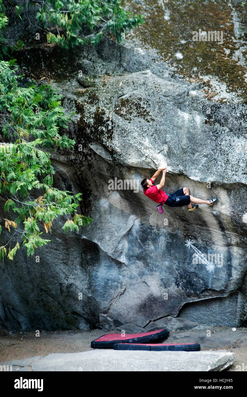Tommy Caldwell, a big wall freeclimber, tackles a boulder problem on