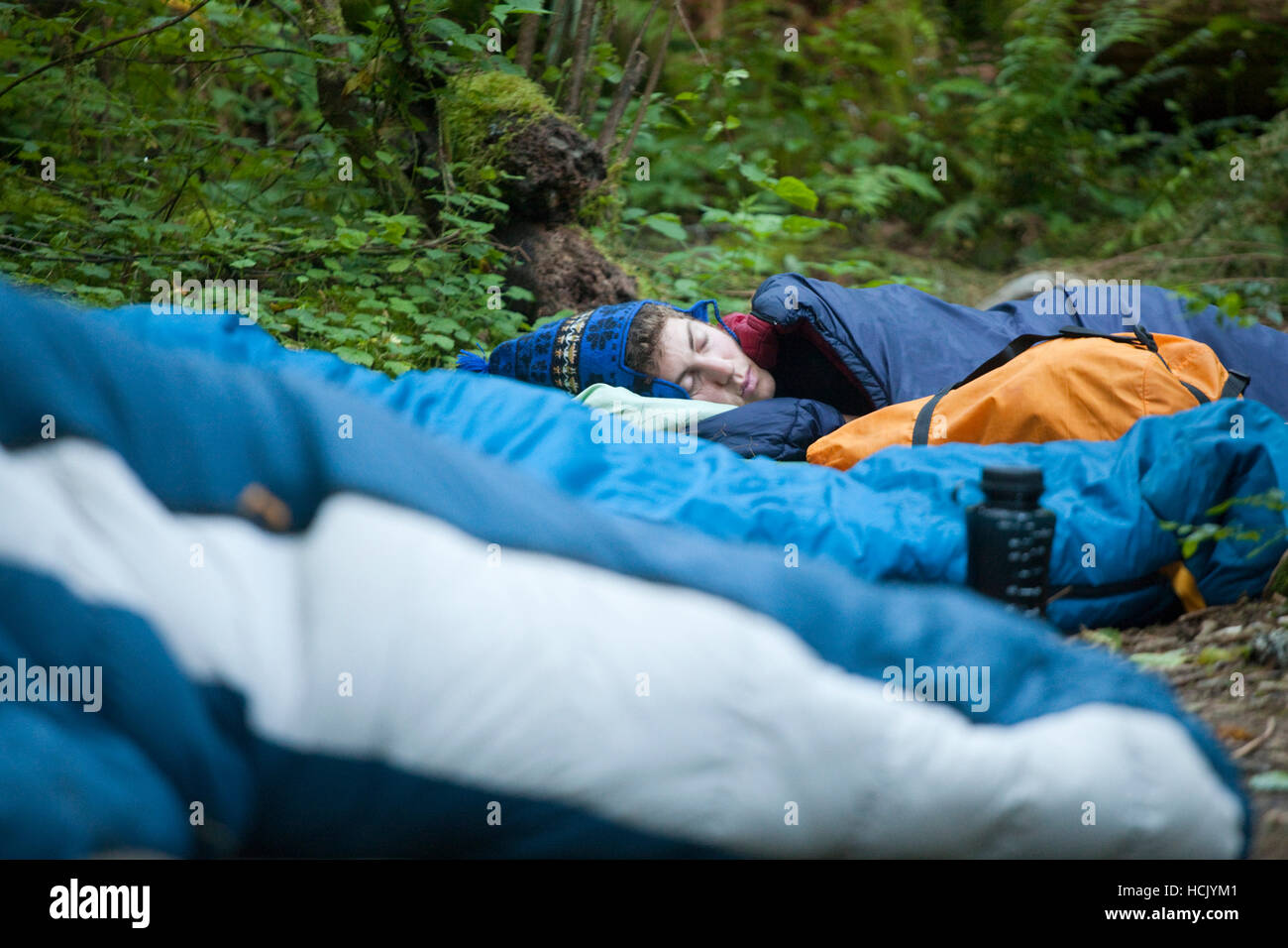 Zach Podell-Eberhardt sleeps soundly in his sleeping bag at Seven and a Half Mile Camp, along Eagle Creek Trail Stock Photo
