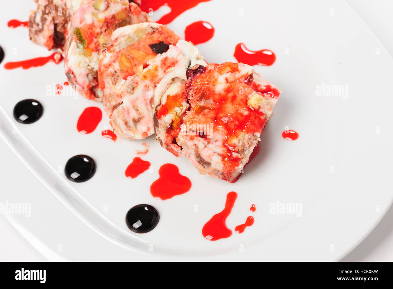 Semifreddo dessert with forest fruits and pistachio nuts Stock Photo