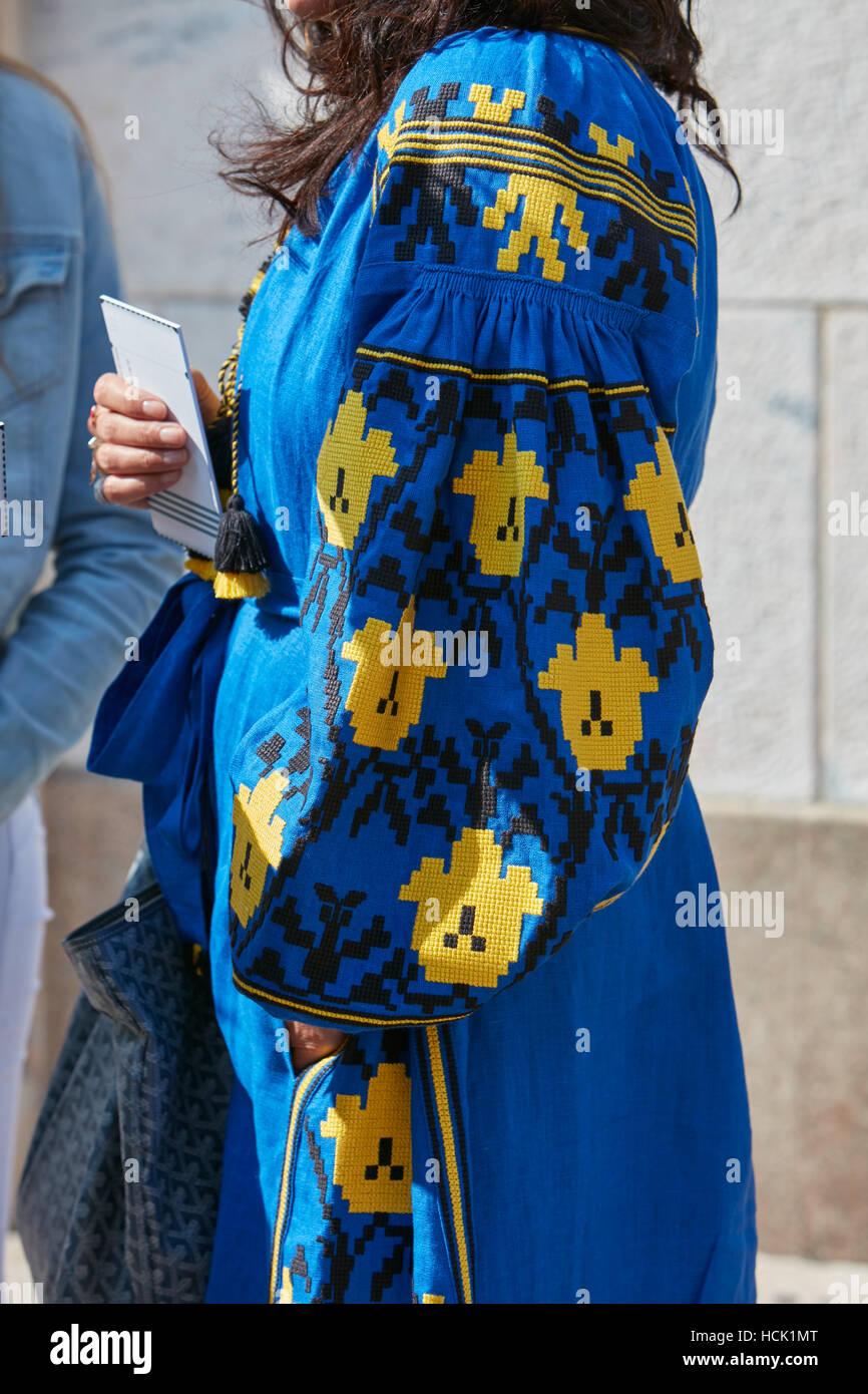 Woman with blue and yellow dress before Stella Jean fashion show, Milan Fashion Week street style on September 25, 2016 in Milan Stock Photo