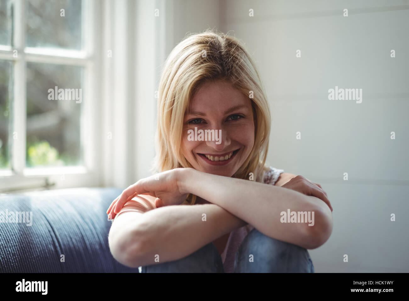 Woman happy sofa sitting hi-res stock photography and images - Alamy