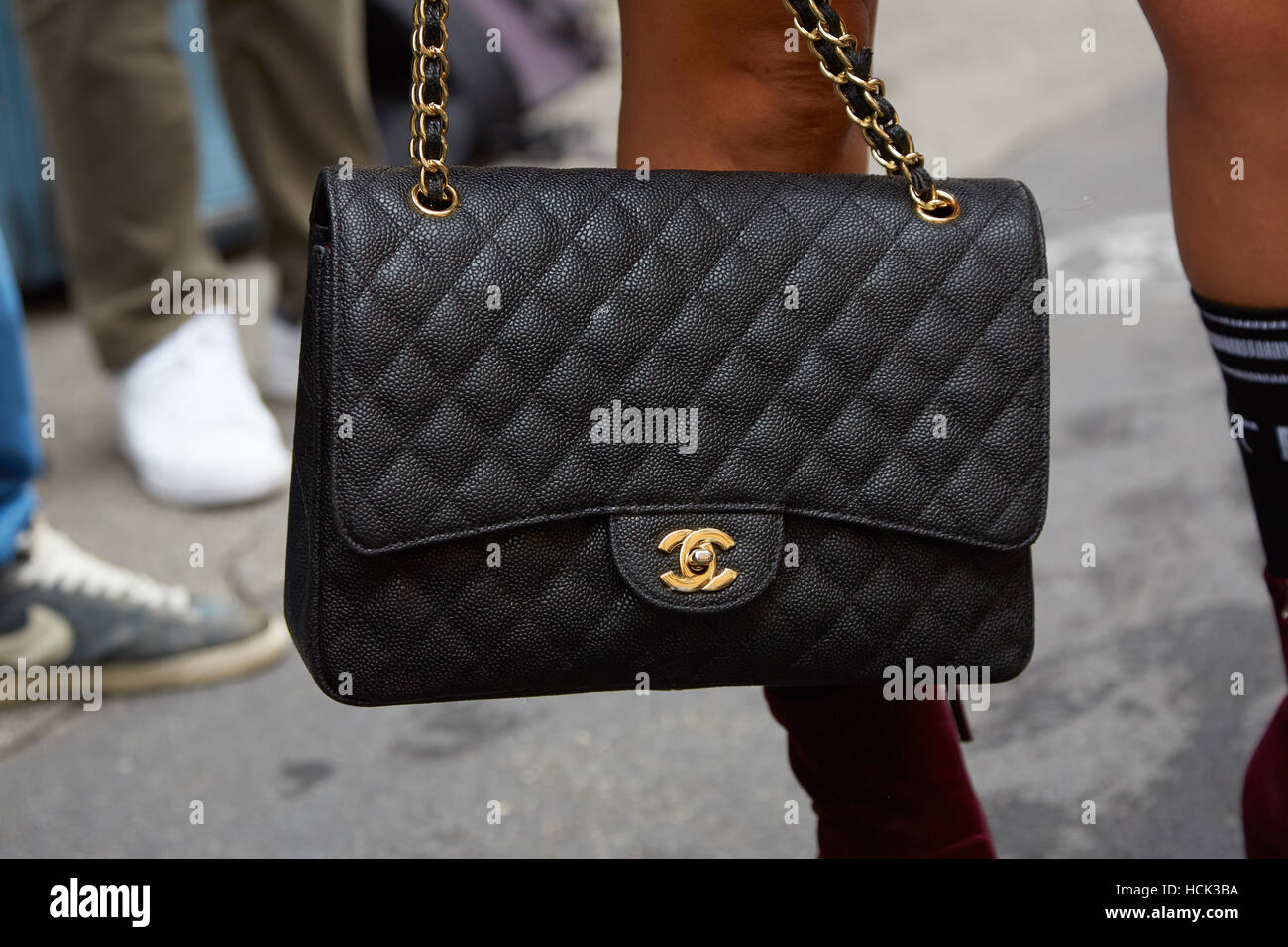 Venice, Italy Jun8 2019: black leather Chanel bag Chanel boy 8 inch.  Classic luxury style gold chain with black leather Luxury handbag. Shopping  conc Stock Photo - Alamy