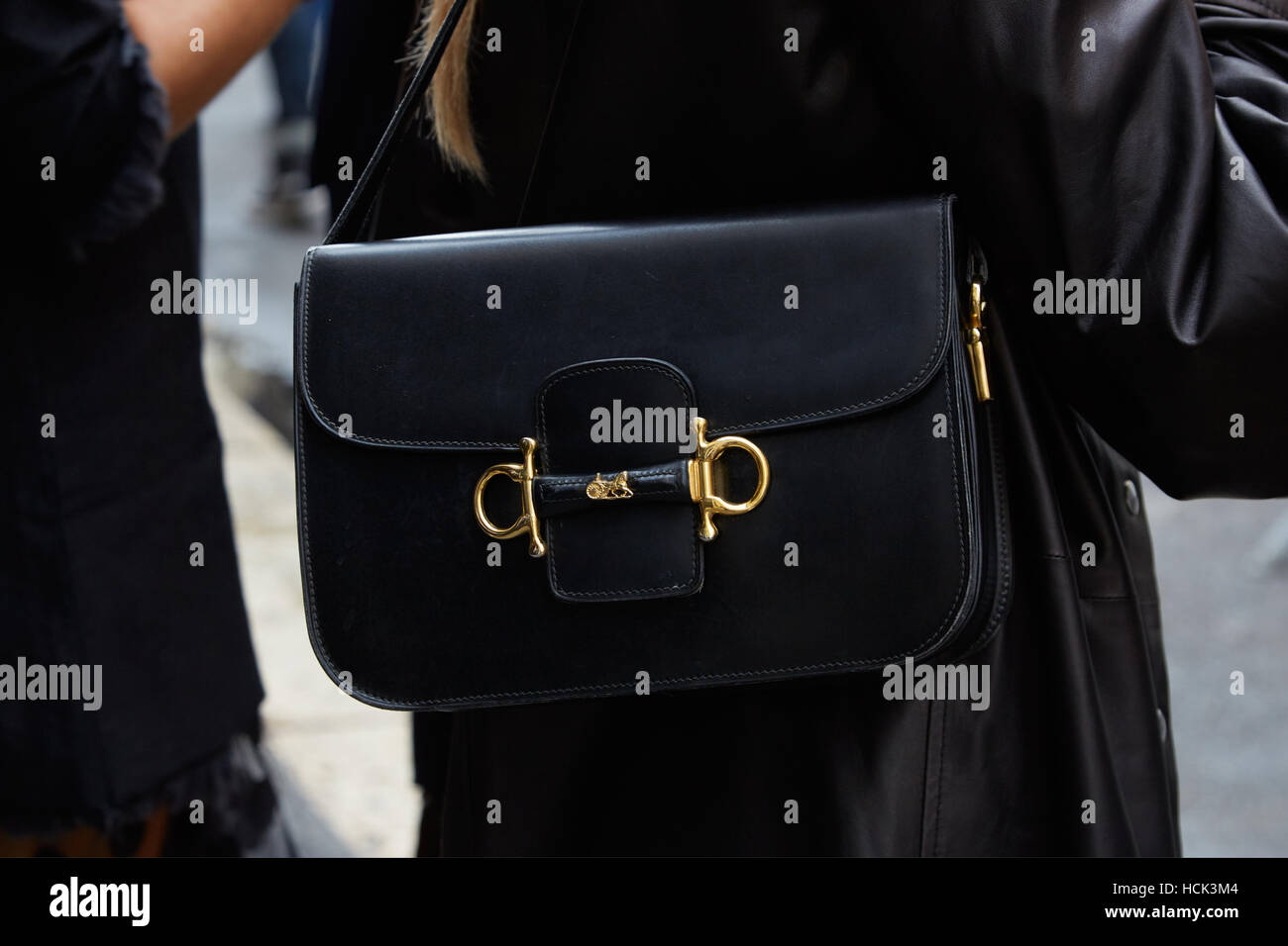Woman with Hermes black leather bag before Wunderkind fashion show, Milan Fashion Week street style on September 21, 2016. Stock Photo