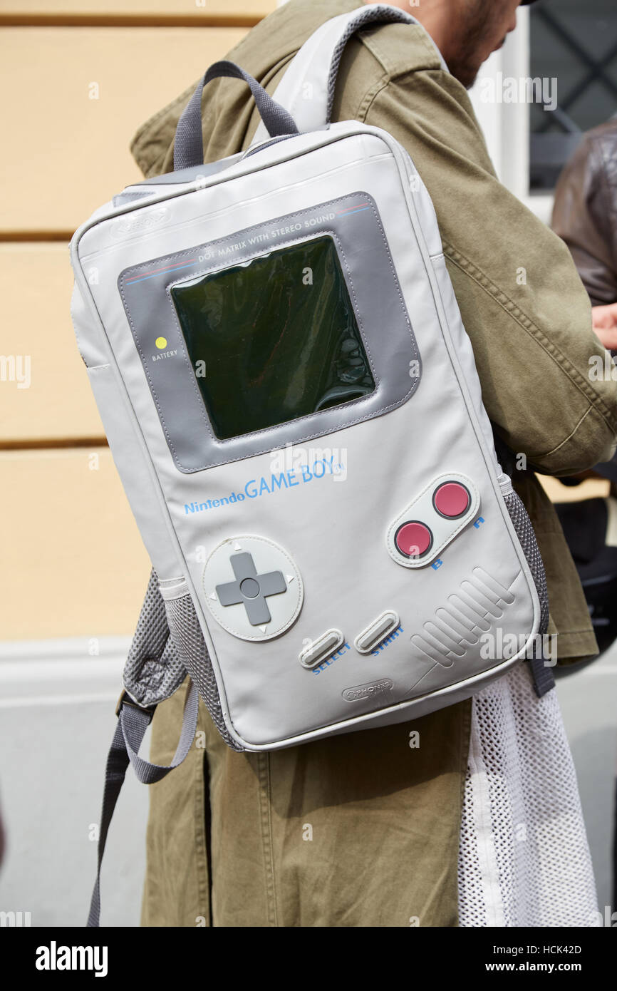 Man with Game boy backpack before Anteprima fashion show, Milan Fashion Week street style on September 22, 2016 in Milan. Stock Photo