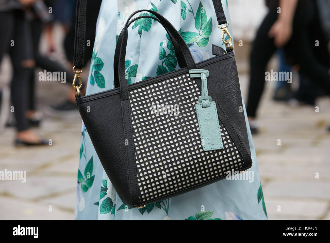 MILAN - JANUARY 13: Man with Louis Vuitton bag and white Gucci shoes before  Diesel Black Gold fashion show, Milan Fashion Week street style on January  Stock Photo - Alamy