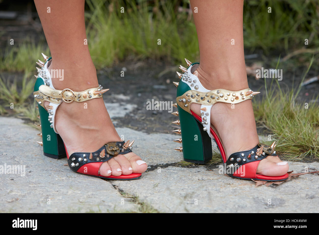 Woman with high heel Gucci shoes with golden before Gucci fashion show, Milan Fashion Week street style on September 21 Stock Photo - Alamy