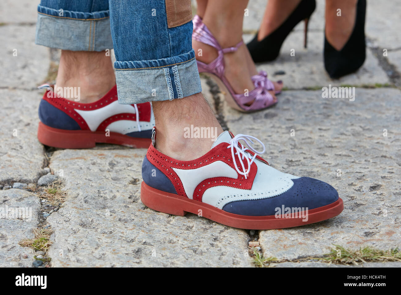 Man with white, blue and red shoes before Gucci fashion show, Milan Fashion Week street style on September 21, 2016 in Milan. Stock Photo