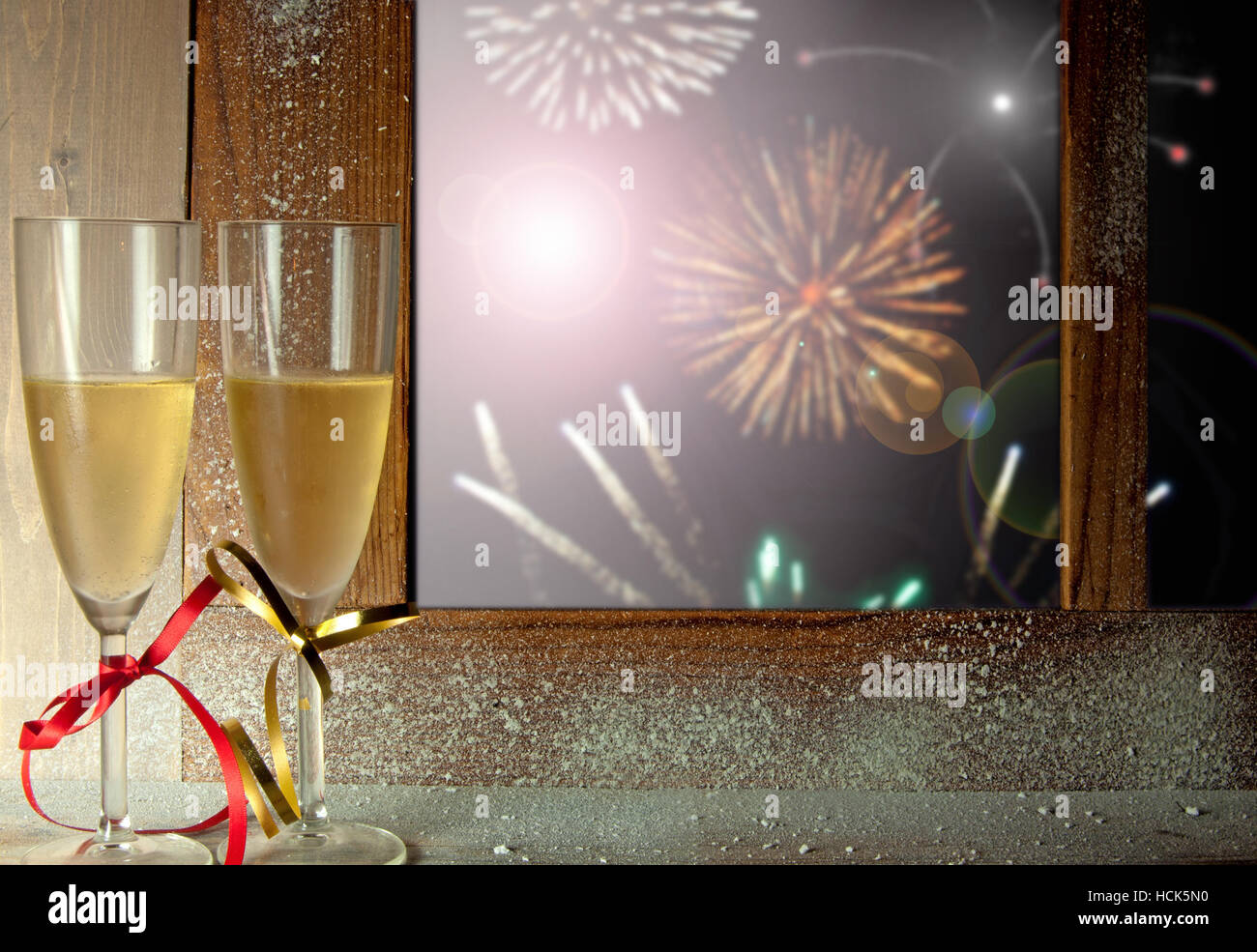 Firework display through a window with champagne glasses Stock Photo ...