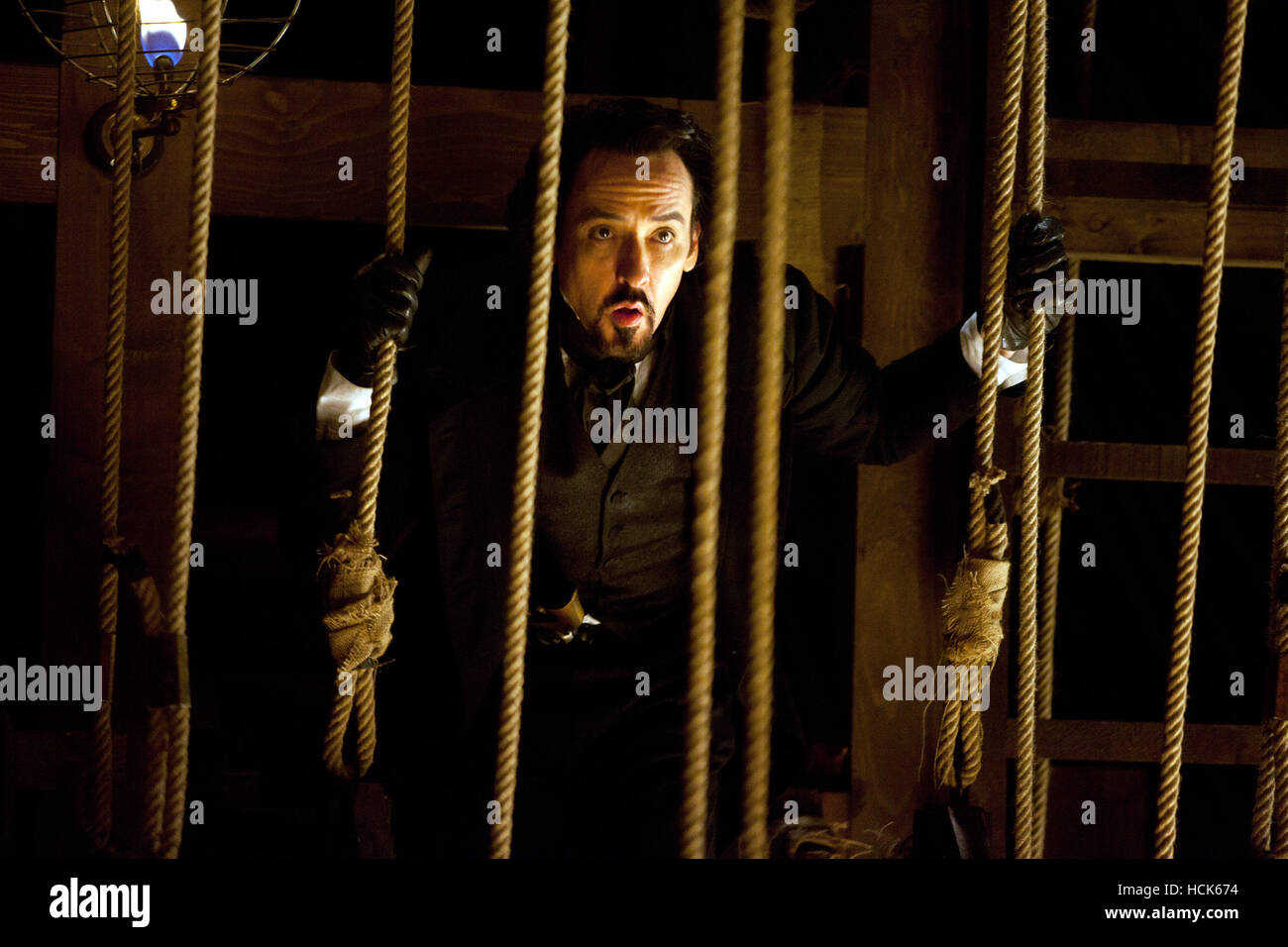 THE RAVEN, John Cusack, as Edgar Allan Poe, 2012. Ph Larry Horricks