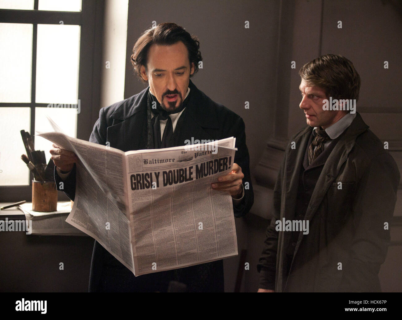 THE RAVEN, from left John Cusack, as Edgar Allan Poe, James Hazeldine