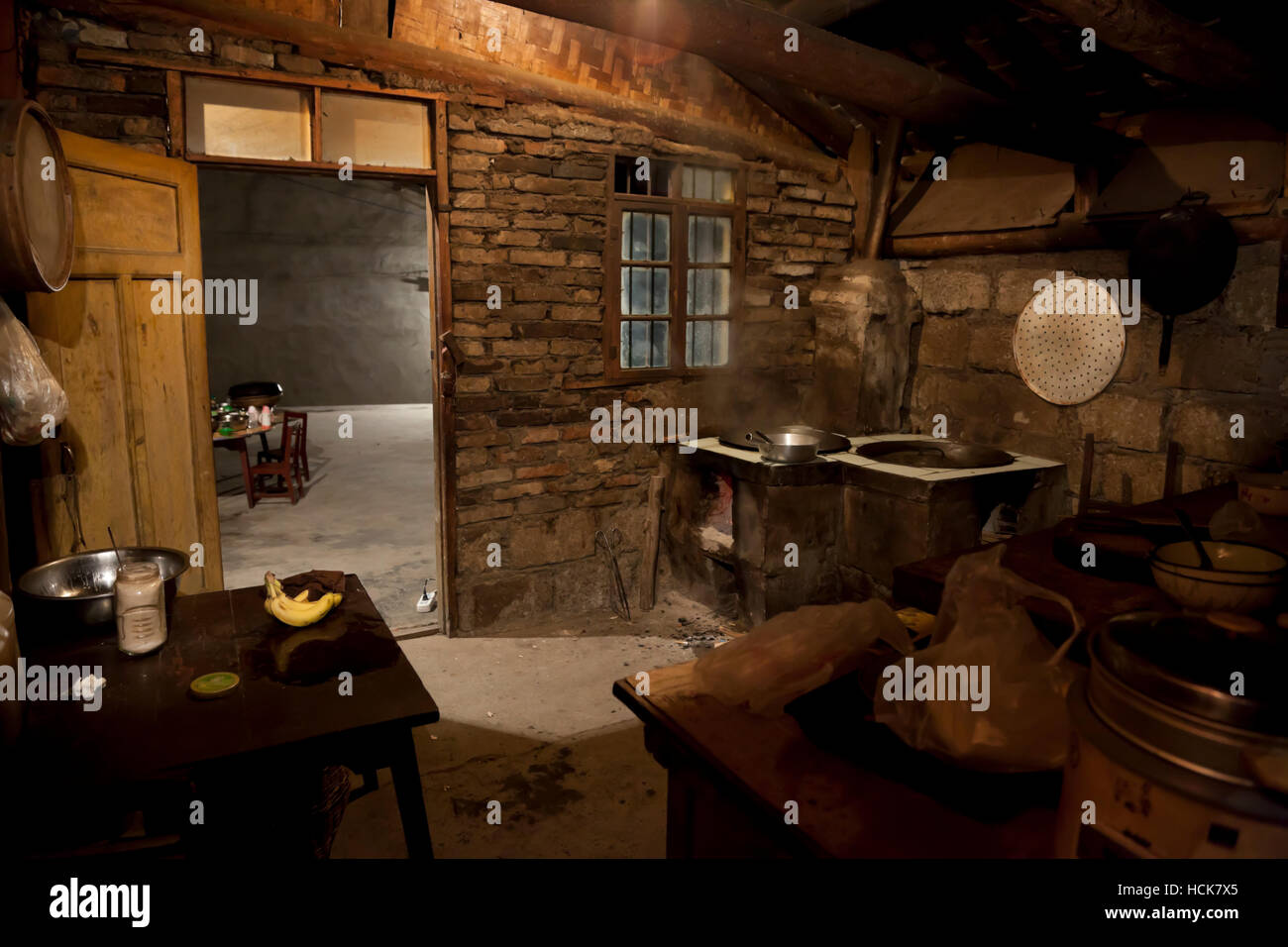The dingy, rustic kitchen of a farmhouse in the remote mountains of west China. Stock Photo