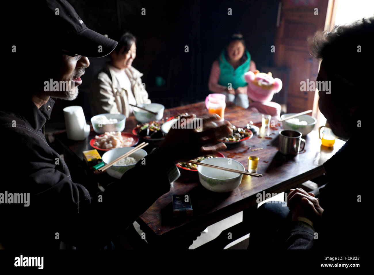 Lunch at a farmhouse in a remote farmers' village in the mountains of west China. Stock Photo