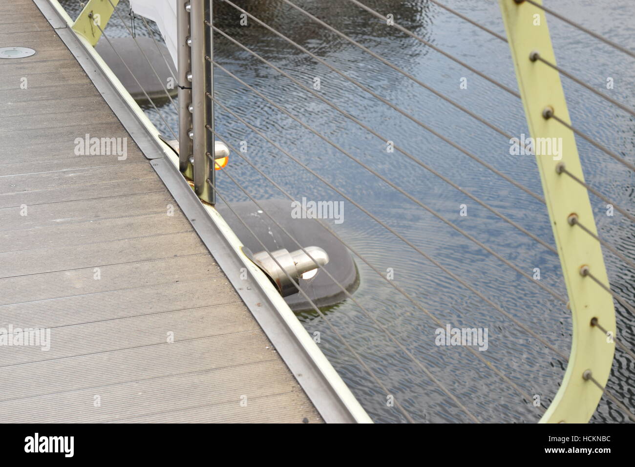 Metal railing with metal strings on a bridge Stock Photo - Alamy