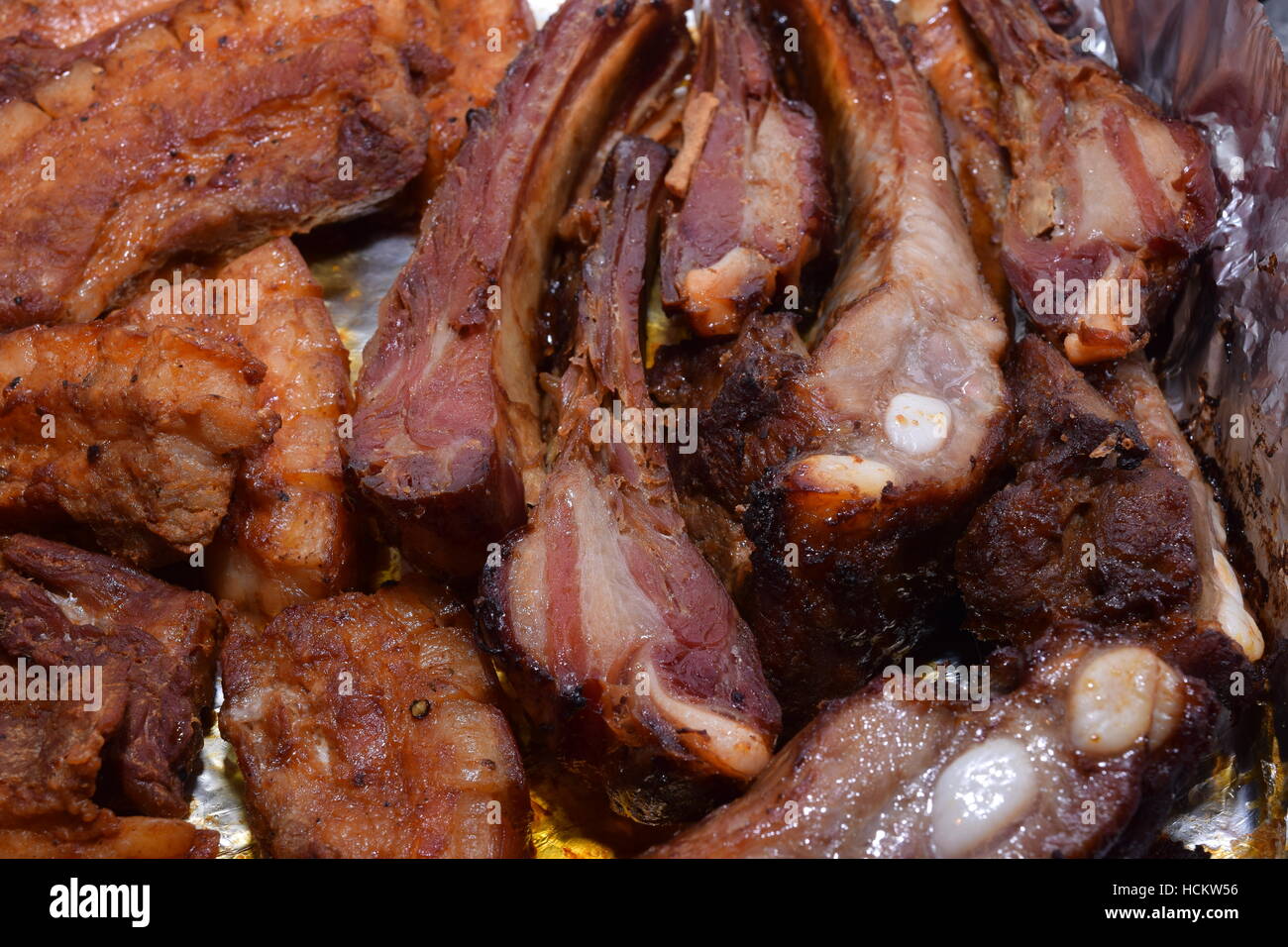 Cooked meat with bones on a baking tray freshly cooked Stock Photo 