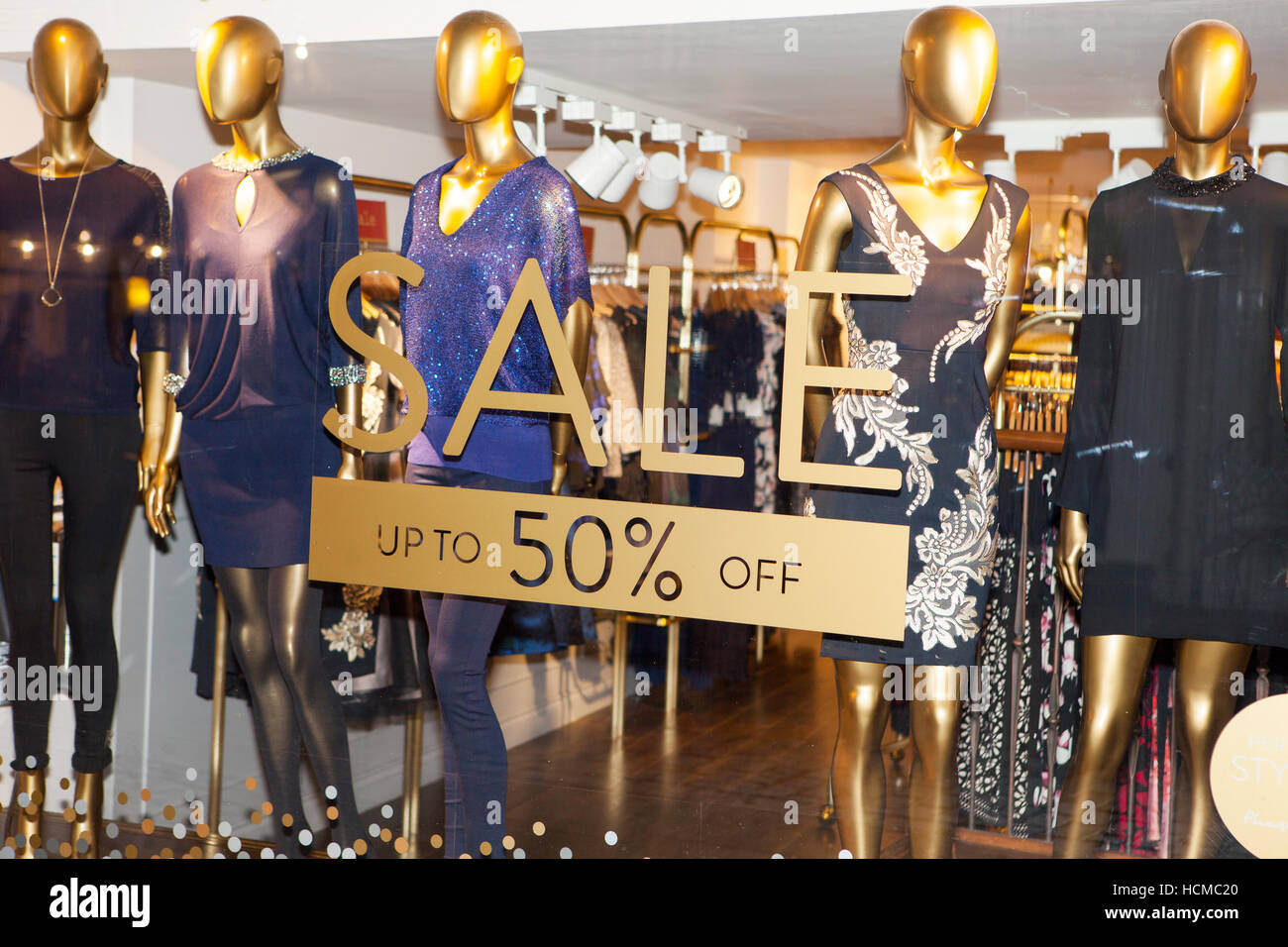 Clothing Shops, signs, and shoppers in the retail sector of the City of