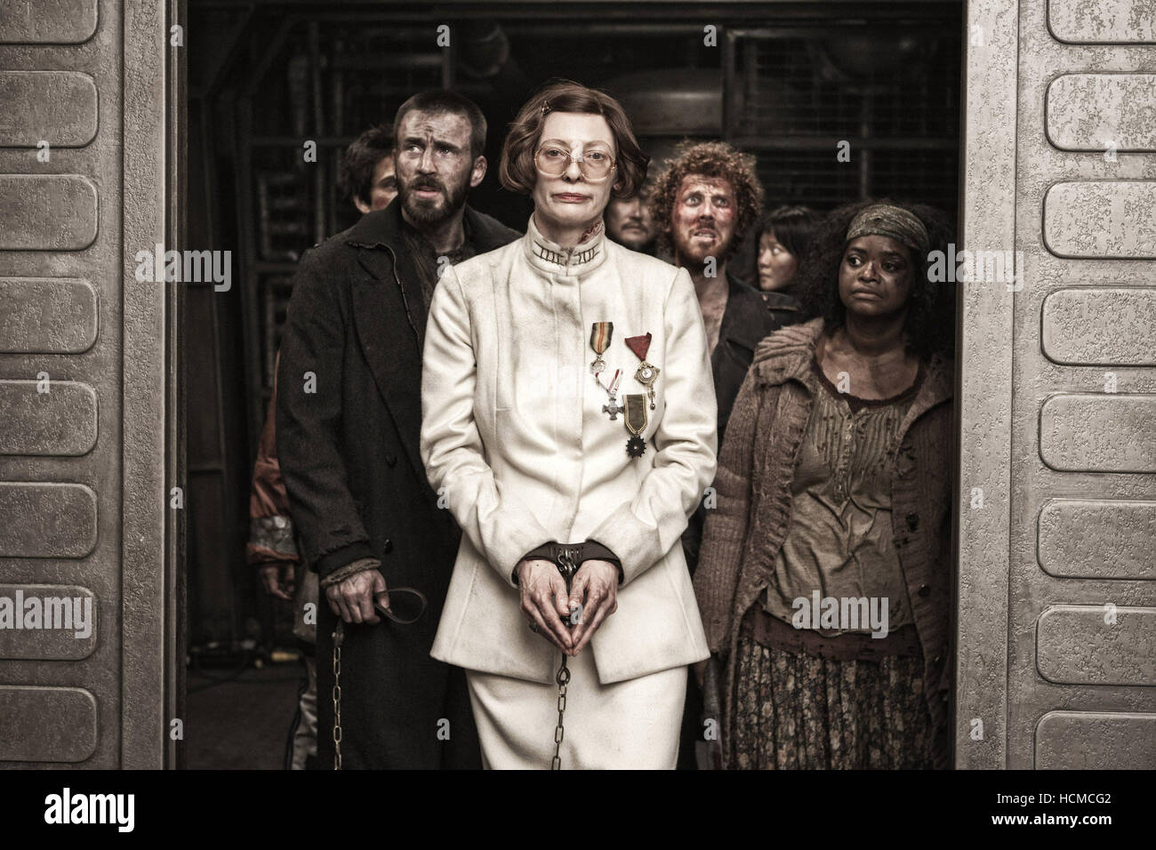 SNOWPIERCER, from left: Chris Evans, Tilda Swinton, Octavia Spencer, 2013.  ©Weinstein Company/Courtesy Everett Collection Stock Photo - Alamy, image size:1300x956