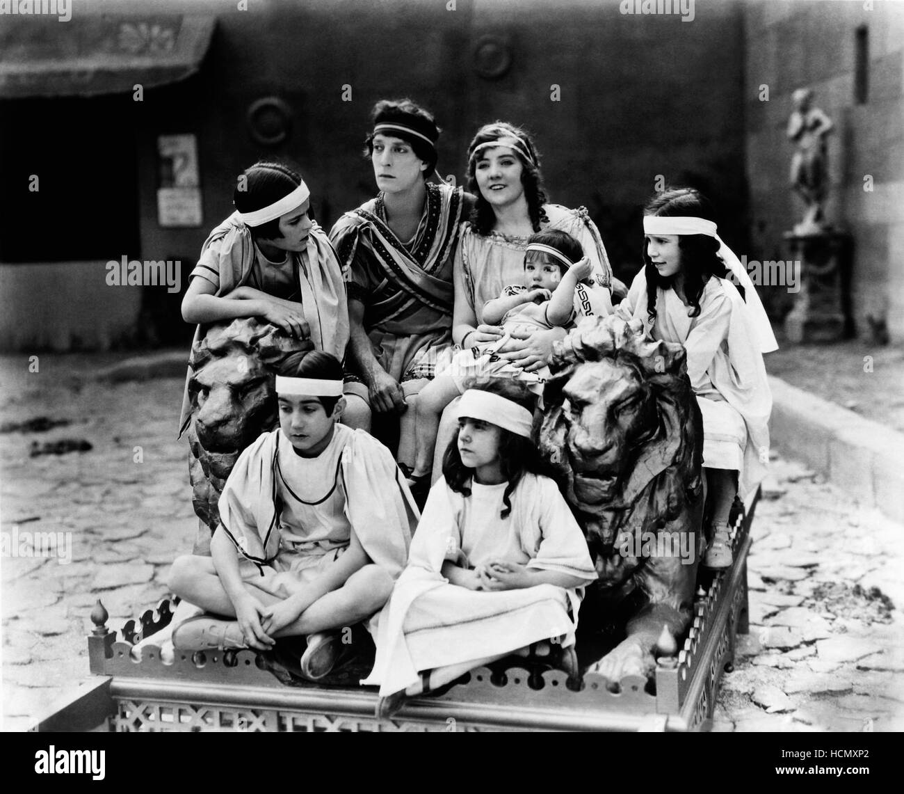 THE THREE AGES, Buster Keaton (rear second from left), Margaret Leahy (holding child), 1923