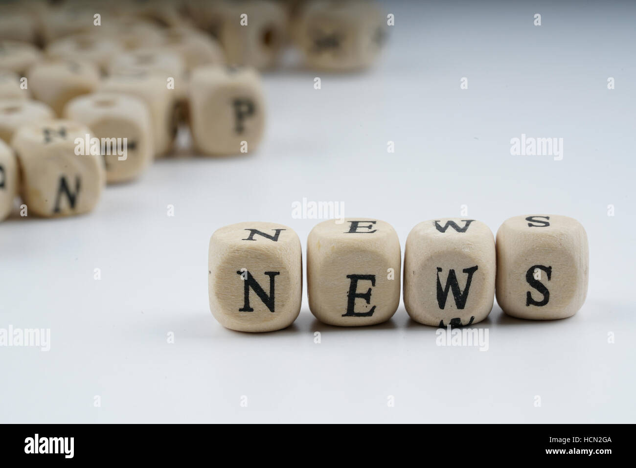 Wooden letter cube with white background Stock Photo - Alamy
