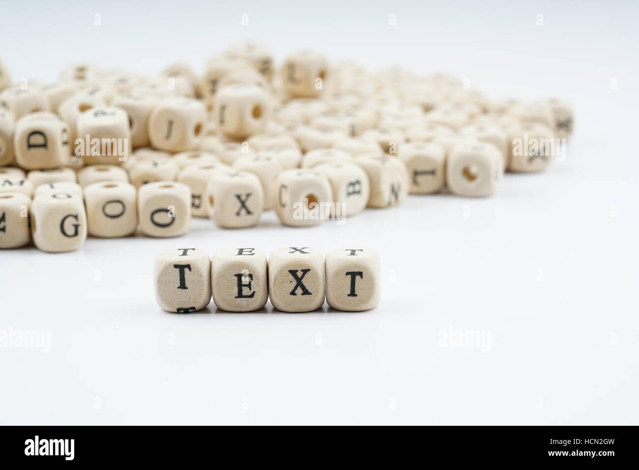 Wooden letter cube with white background Stock Photo - Alamy