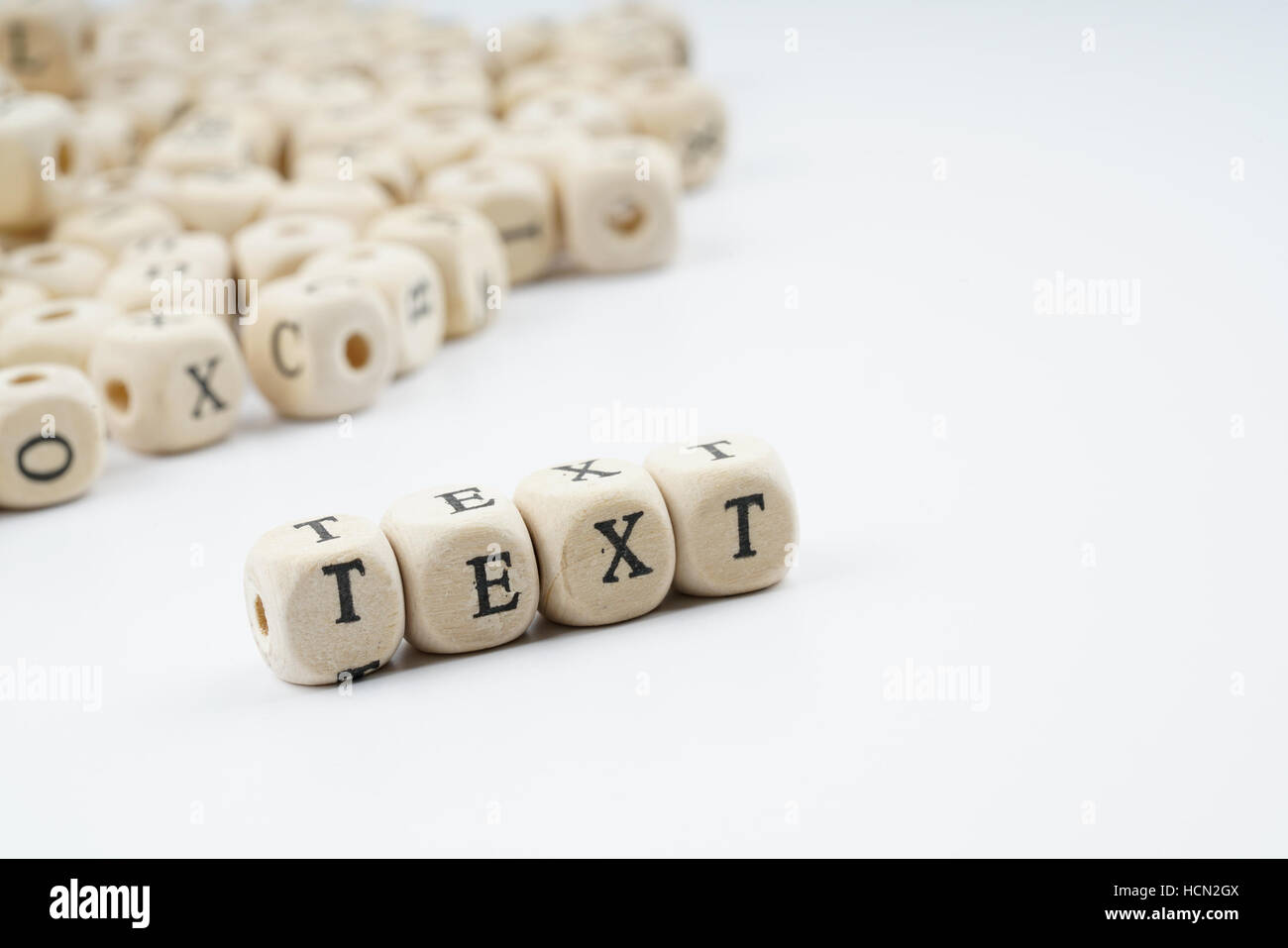 Wooden letter cube with white background Stock Photo - Alamy