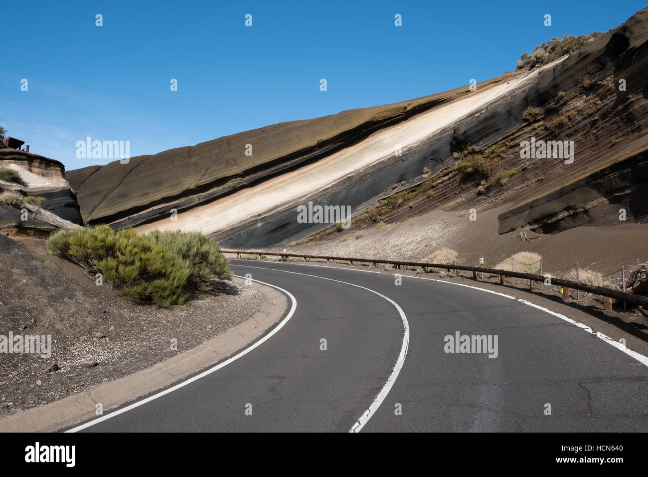 empty road in mountain landscape - stratified volcanic rock. La Negrita, Pico del Teide, Tenerife - famous curve, striped rock Stock Photo