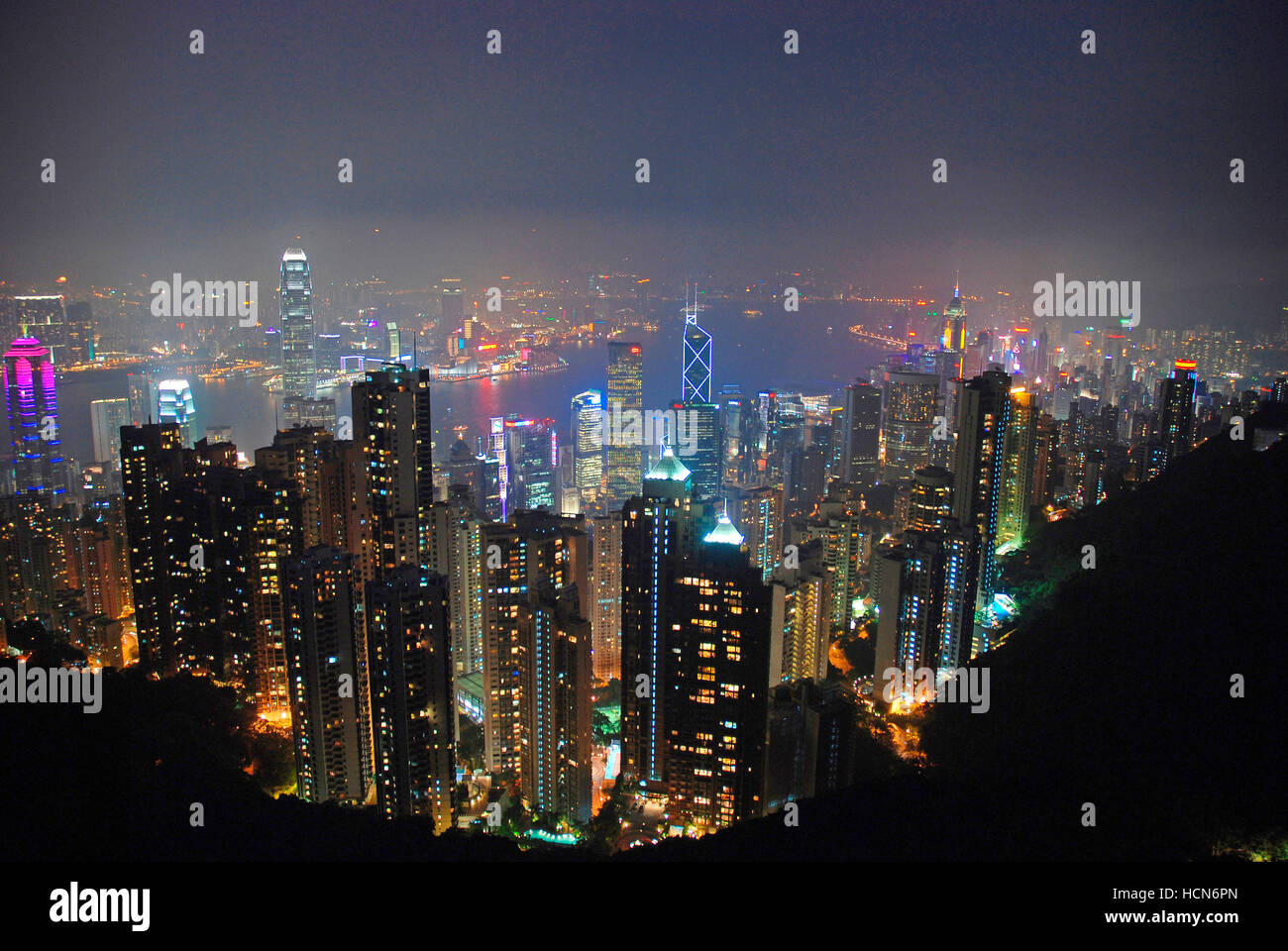 Hong Kong skyline and Victoria Harbor at night seen from Victoria peak ...