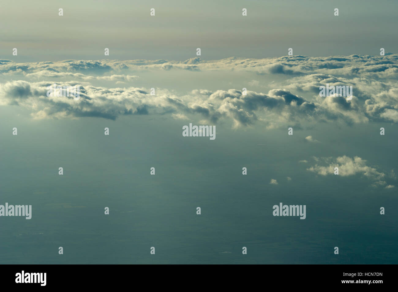 View of the clouds and sky above from the airplane window Stock Photo ...