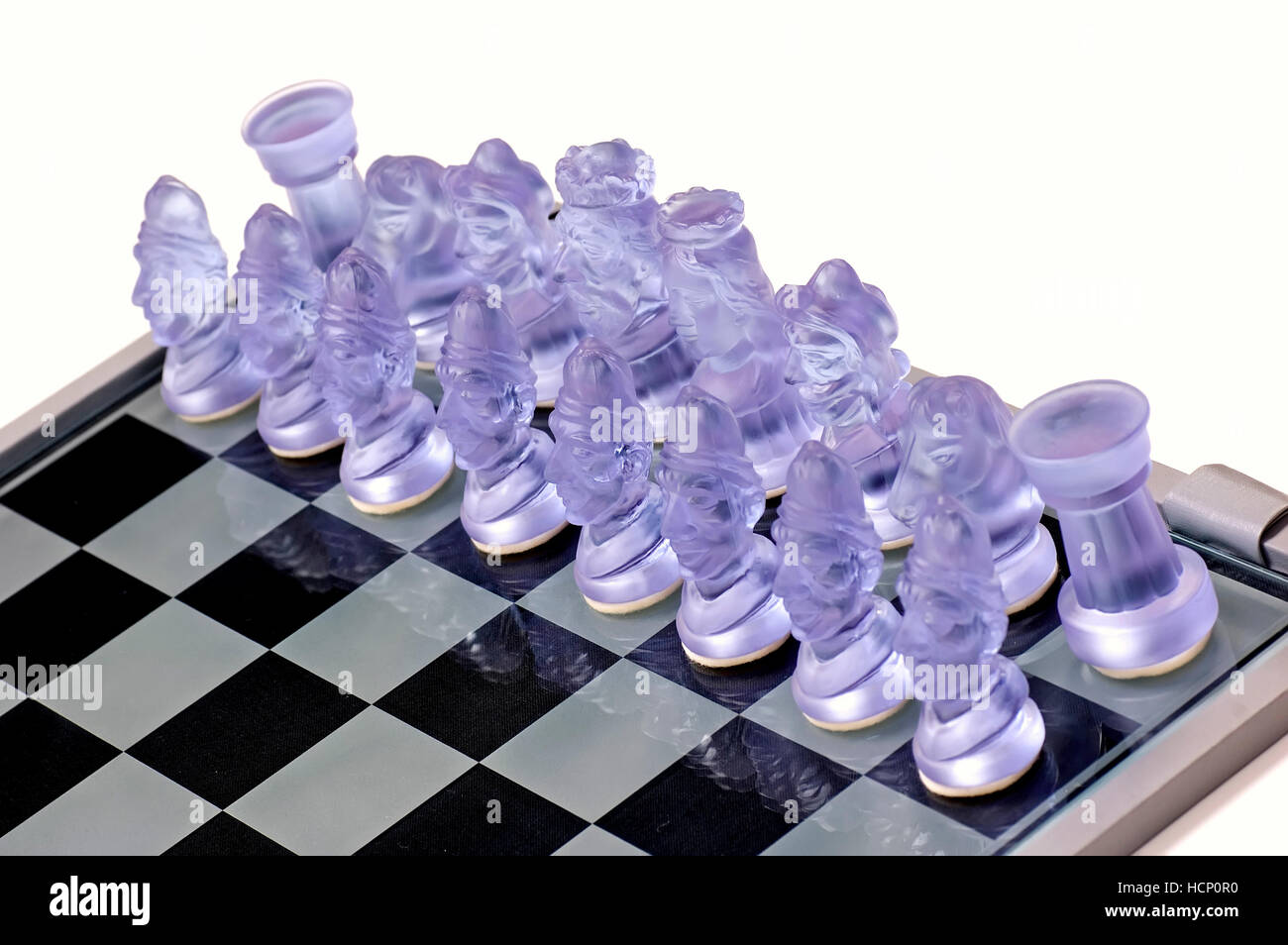 Ready to play white pieces of chessmen made from crystal glass. Stock Photo