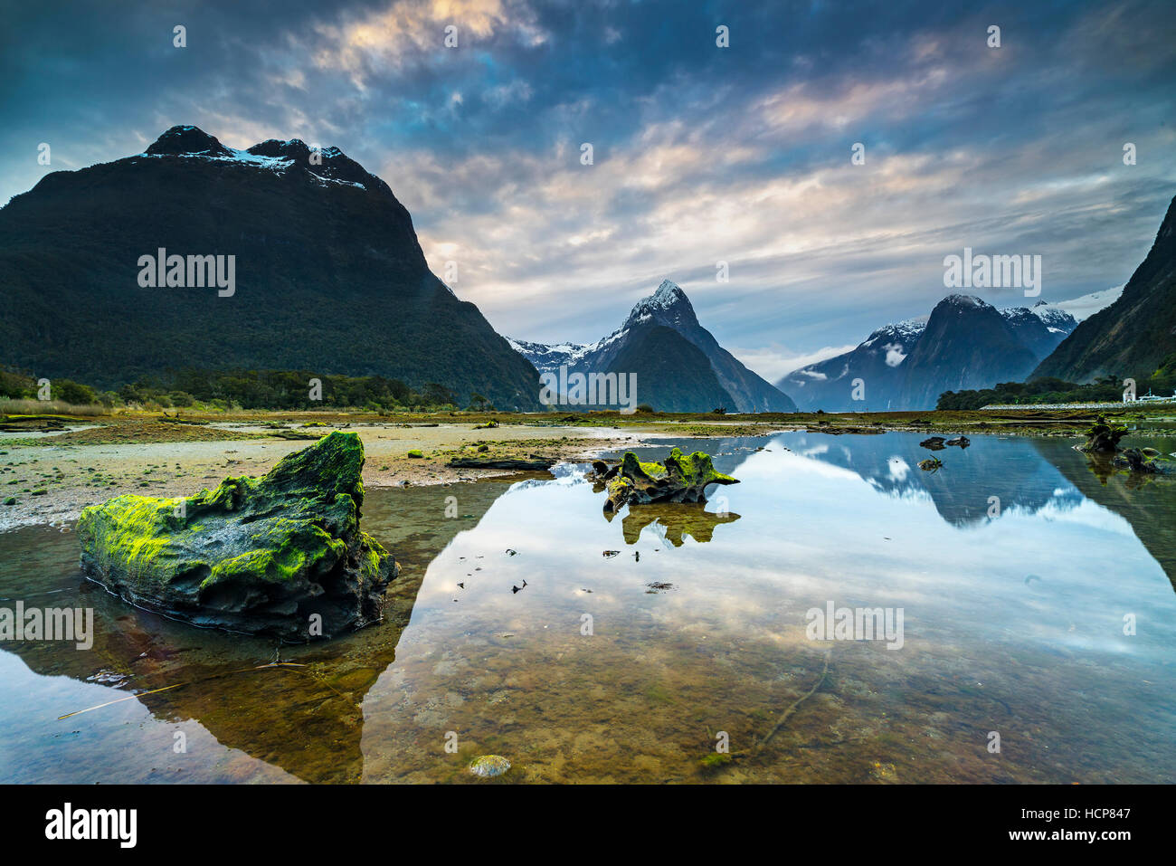Sunrise and reflection at Mitre Peak, Milford Sound in Fiordland National Park, New Zealand Stock Photo