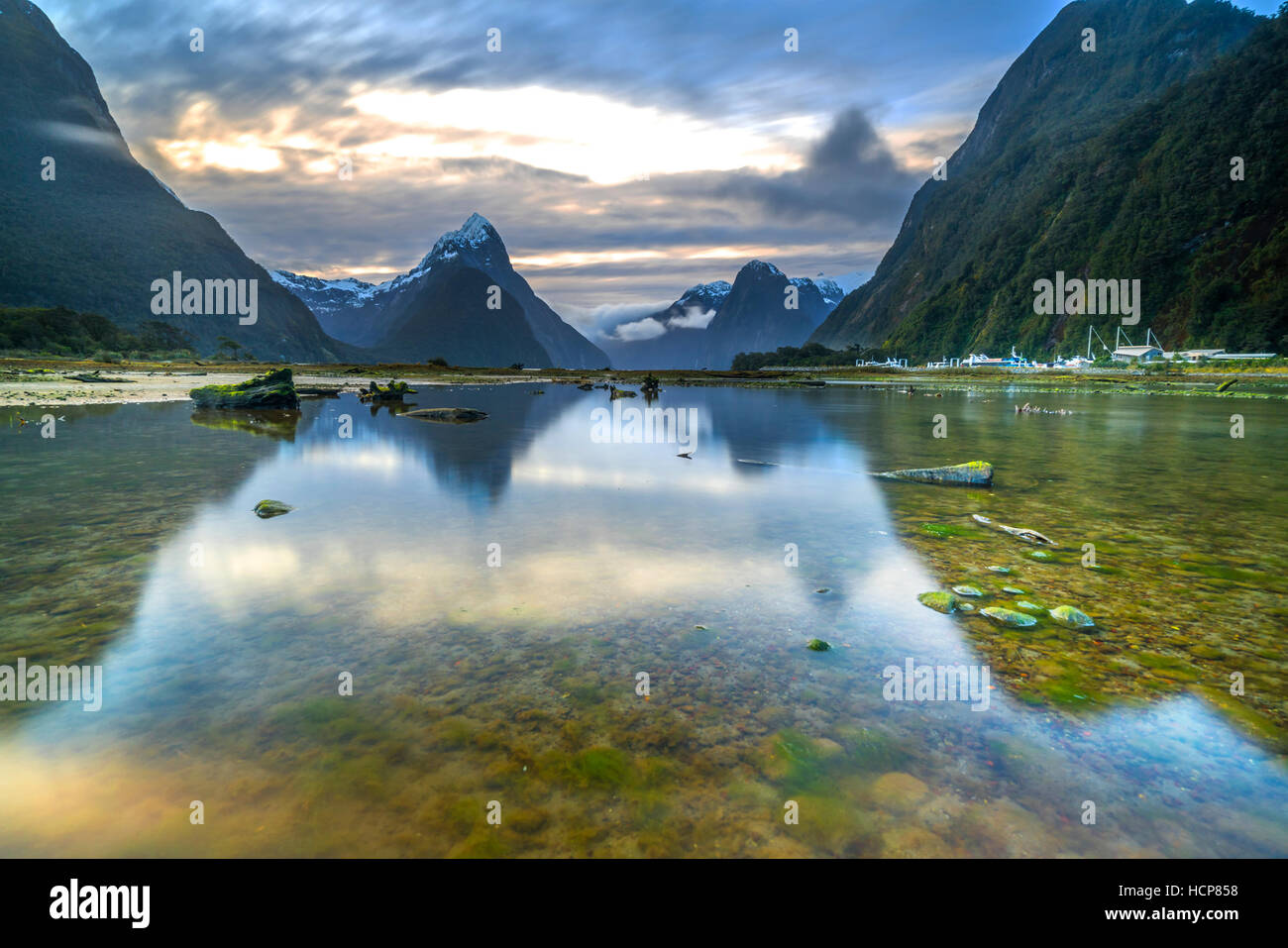 Sunrise and reflection at Mitre Peak, Milford Sound in Fiordland National Park, New Zealand Stock Photo