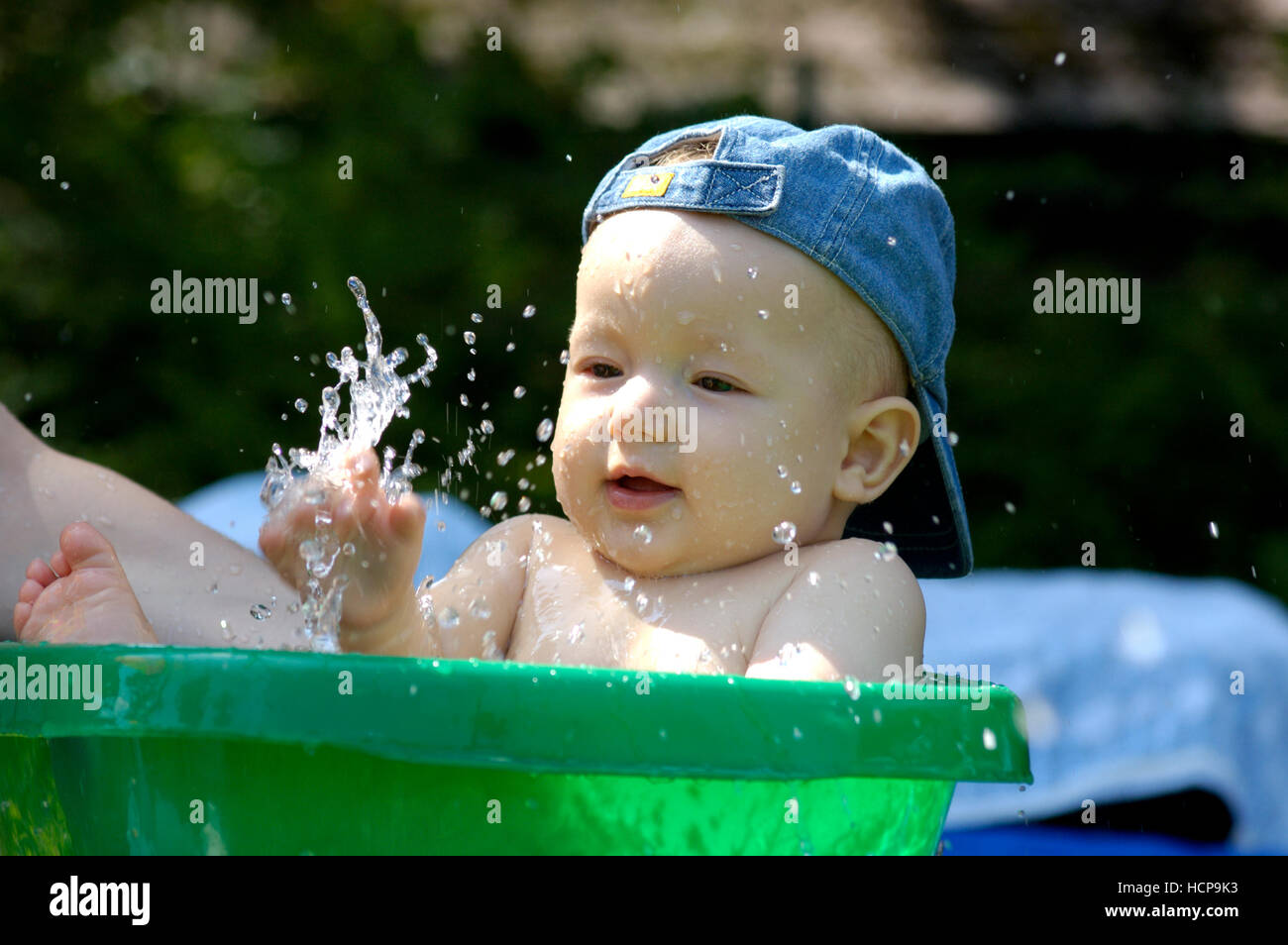 Baby bathing in a small tub Stock Photo Alamy