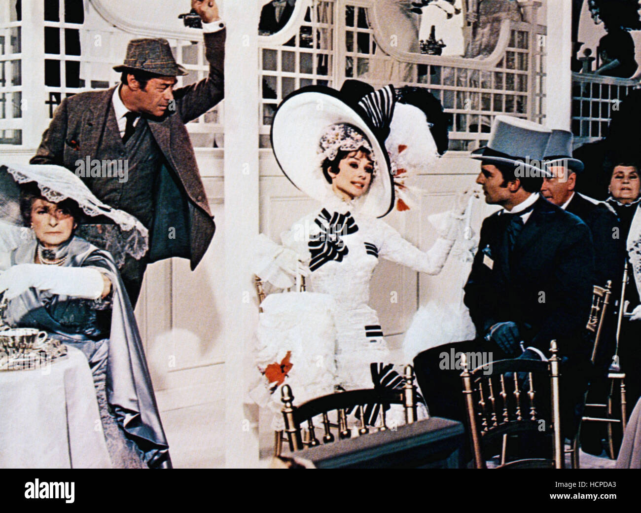 MY FAIR LADY, Rex Harrison (back left), Audrey Hepburn (center of frame
