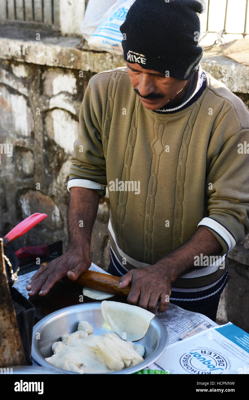 Puri ( fried dough bread ) is a popular breakfast in northern India. Stock Photo