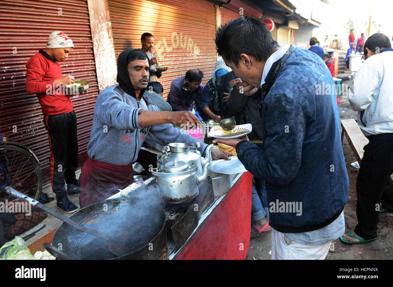 Indian man eating breakfast hi-res stock photography and images - Alamy