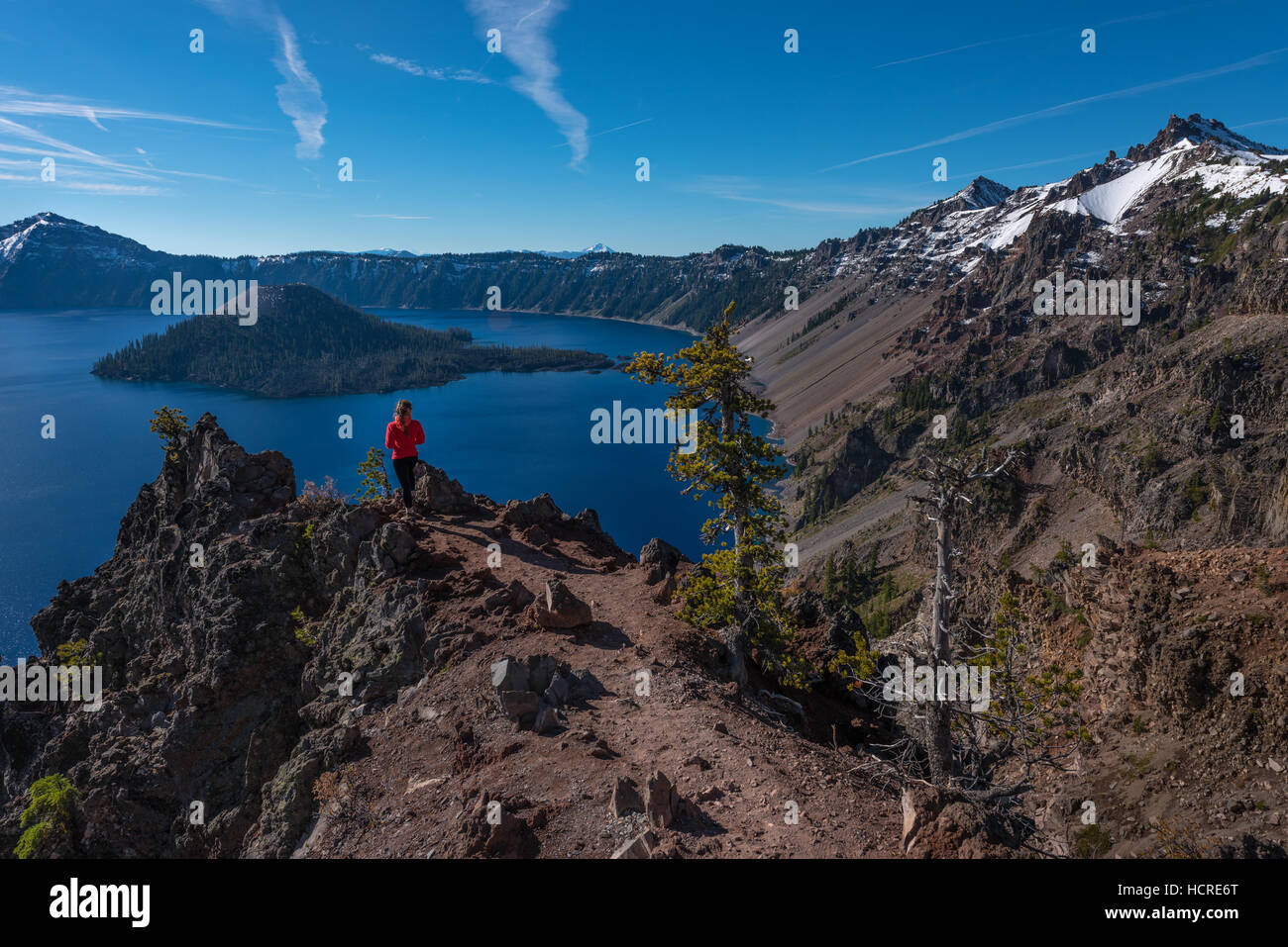 Tourist admiring Crater Lake as seen from Merriam Point with wizard