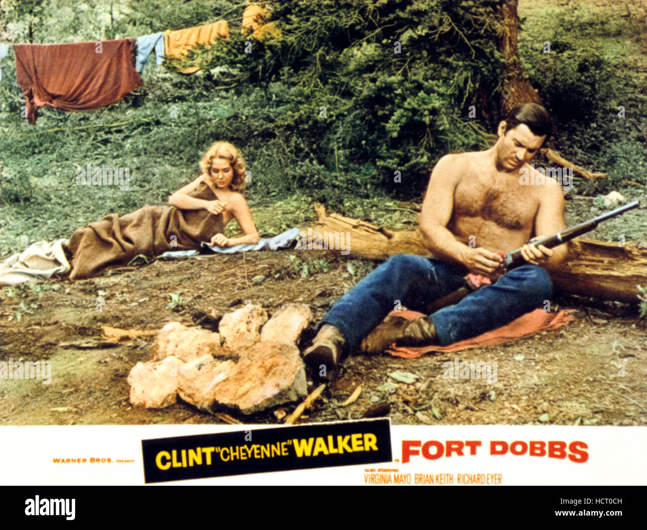 FORT DOBBS, l-r: Virginia Mayo, Clint Walker on lobbycard, 1958 Stock Photo  - Alamy