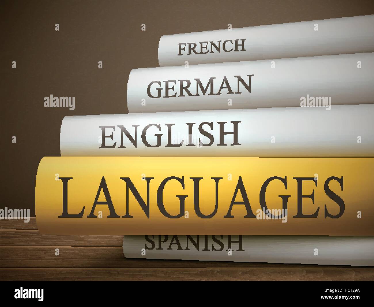 book title of languages isolated on a wooden table over dark background ...
