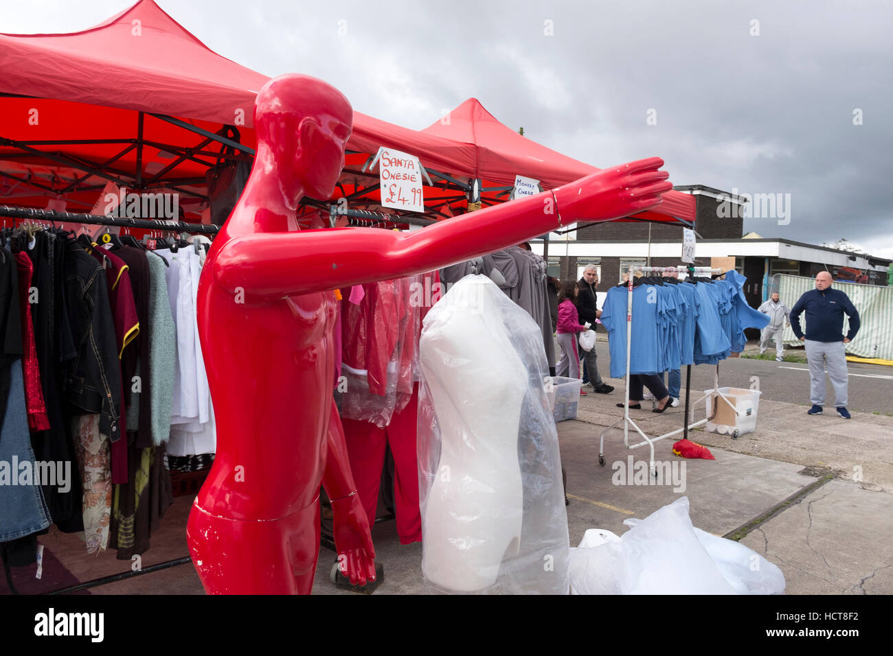 Red Mannequin at Market Stock Photo