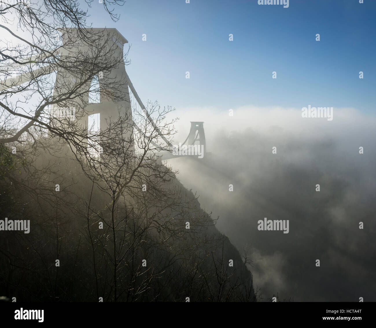 The Clifton Suspension Bridge with fog around it in the Avon Gorge, Bristol Stock Photo