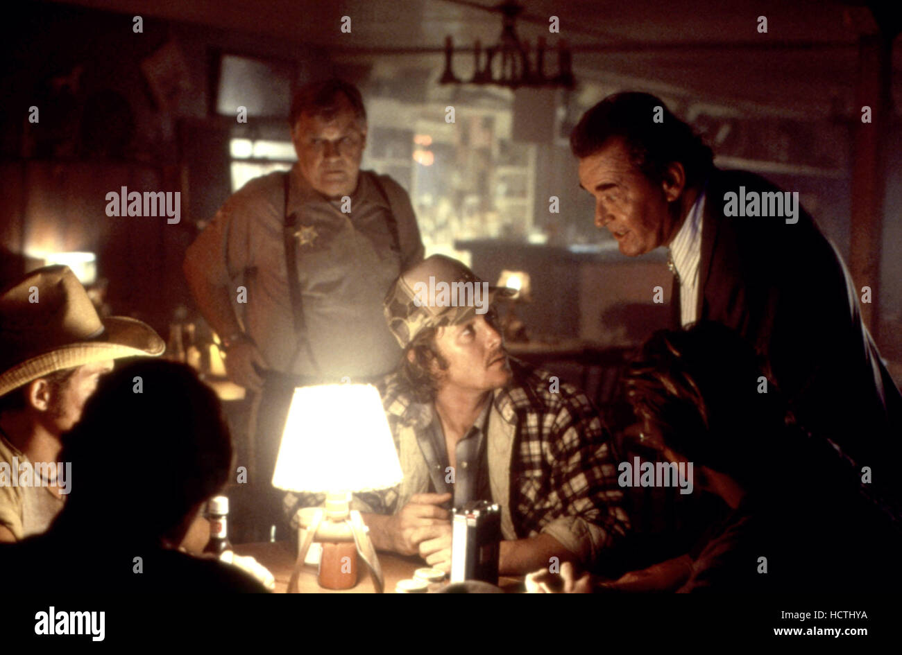 FIRE IN THE SKY, Robert Patrick (seated center), James Garner (right ...