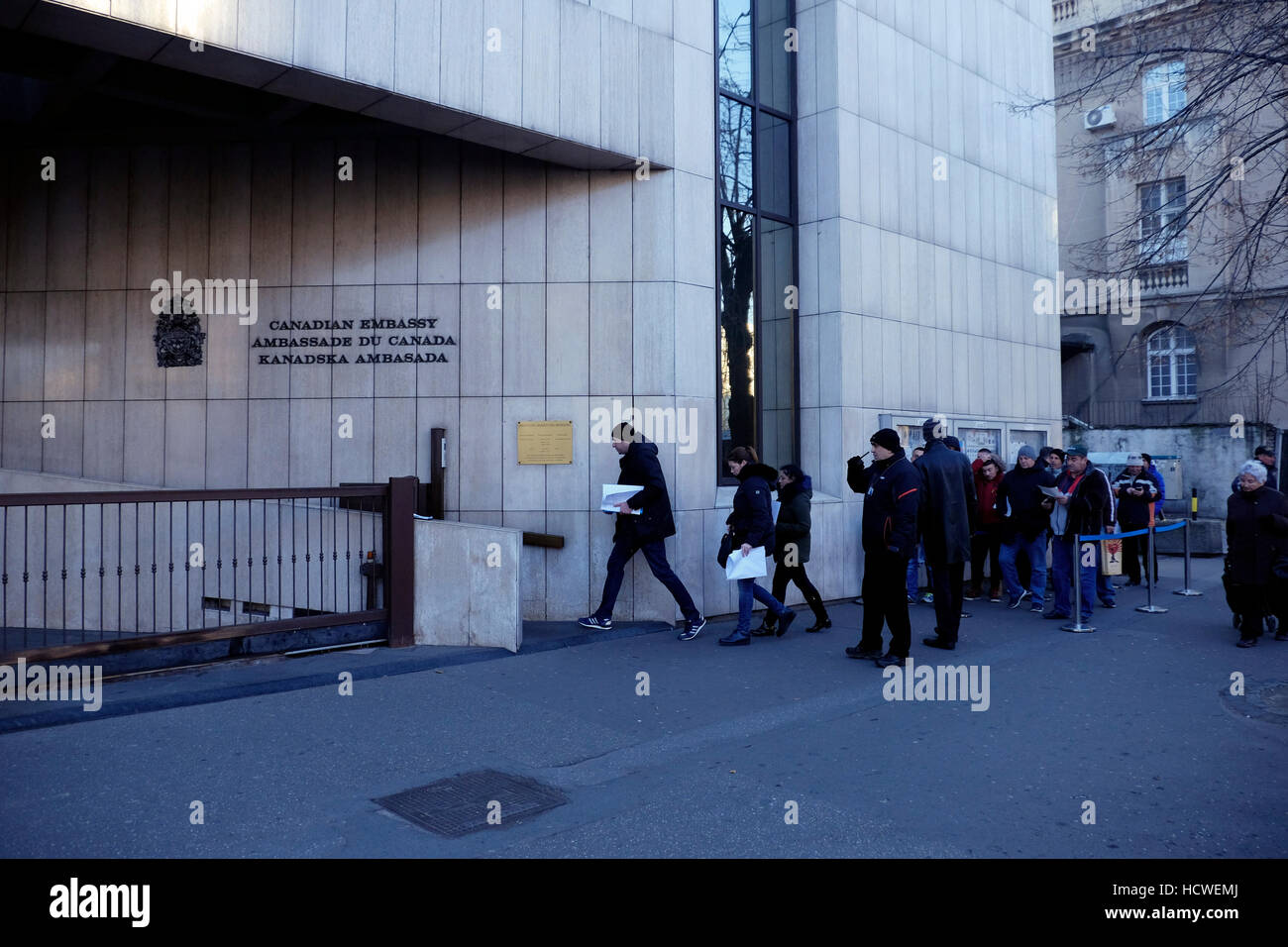 People queuing to enter the Canadian embassy in the city of Belgrade capital of the Republic of Serbia Stock Photo