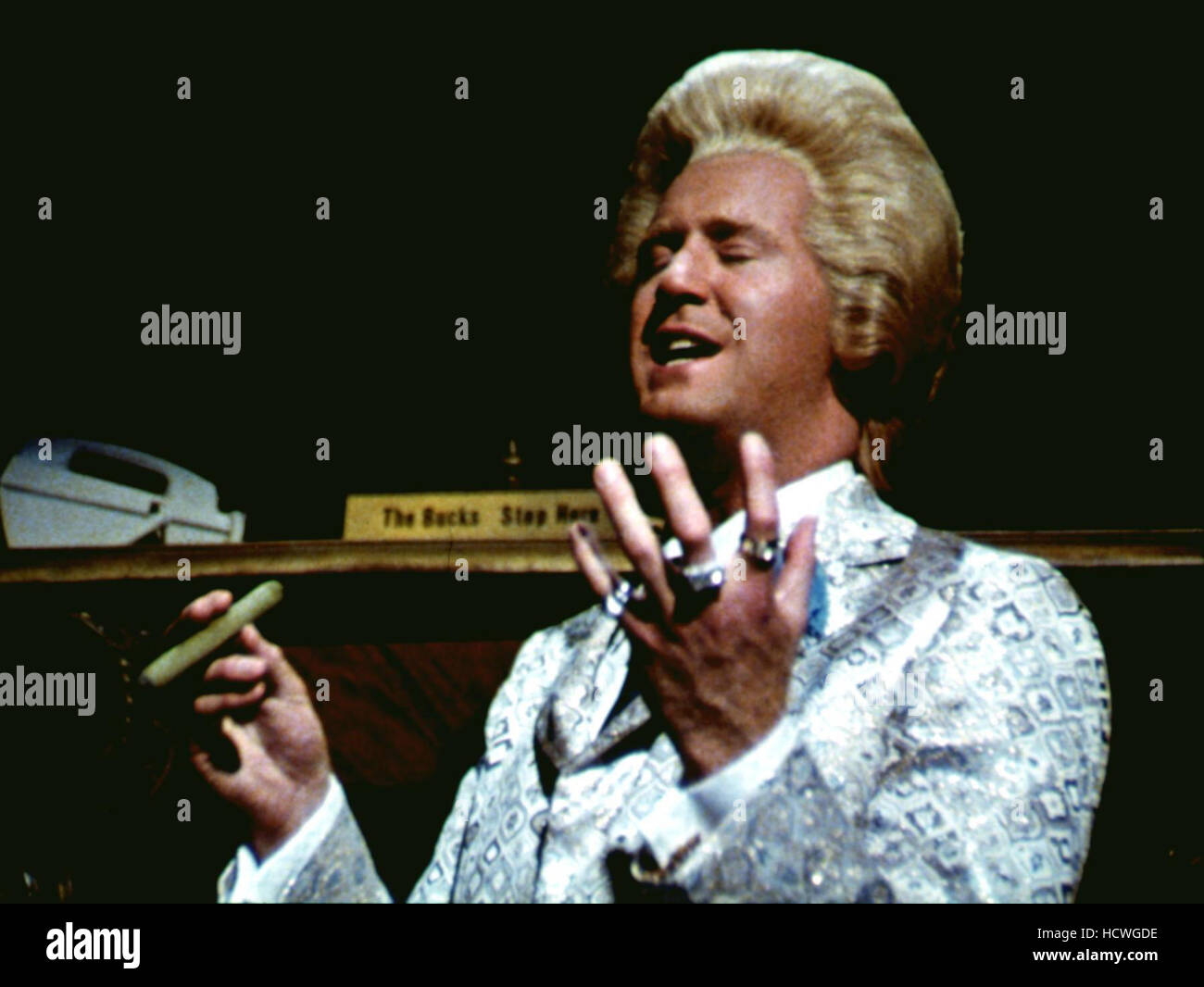 IN GOD WE TRUST, Andy Kaufman, 1980, smoking cigar Stock Photo Alamy