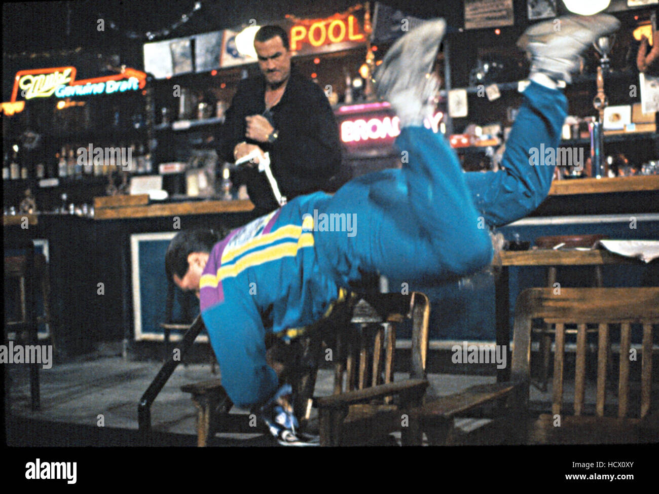 OUT FOR JUSTICE, Steven Seagal, using martial arts to throw his enemy across the bar, 1991 Stock