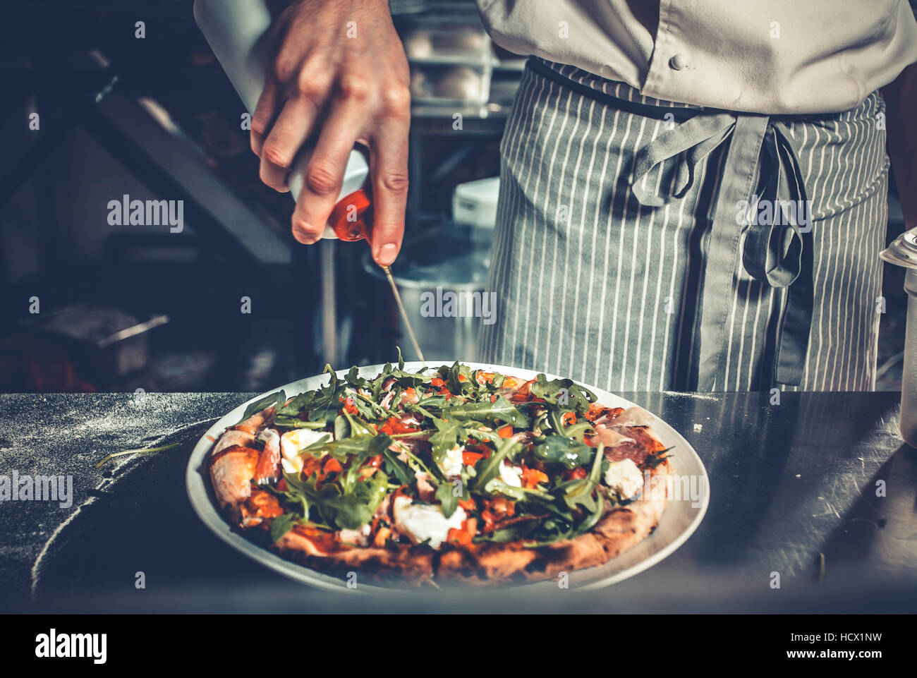 Chef cooking gourmet pizza Stock Photo