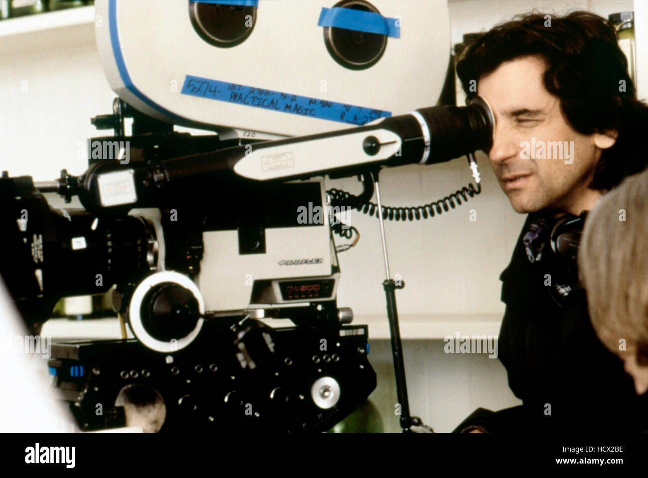 PRACTICAL MAGIC, director Griffin Dunne on-set, 1998. © Warner Bros ...