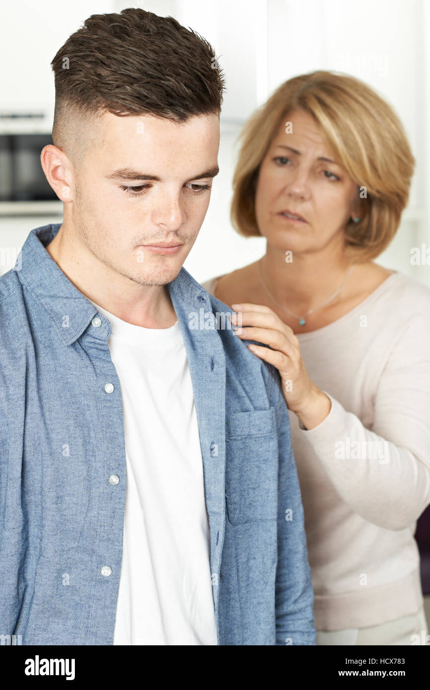 Mother Worried About Unhappy Teenage Son Stock Photo