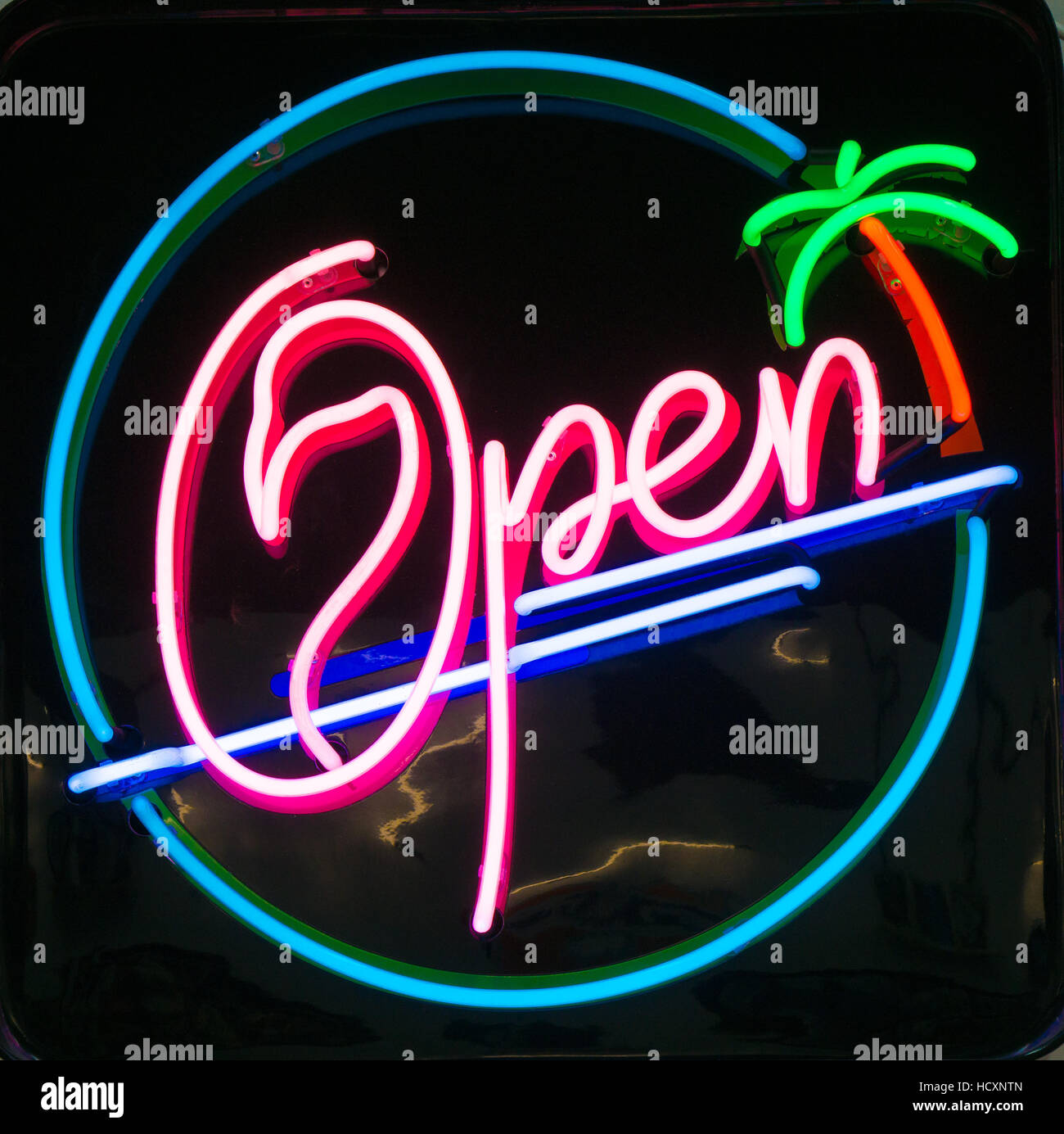 A neon sign saying 'open' Stock Photo