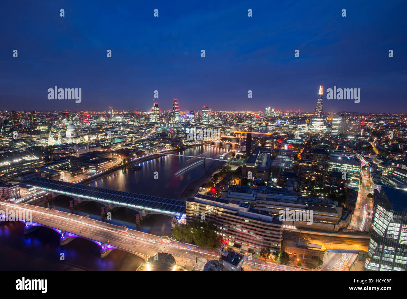 A night-time view of London and the River Thames including The Shard, St. Paul's Cathedral and Tate Modern, London, UK Stock Photo